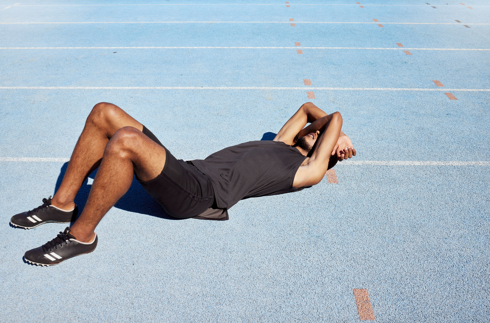 Tired Track Athlete Lying down and Feeling Exhausted. Active, Fi